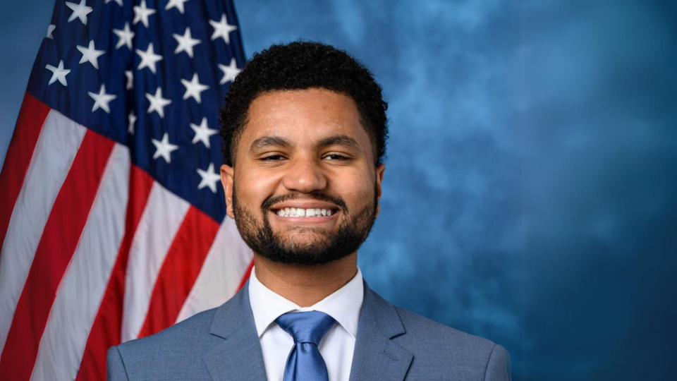 rep maxwell frost in front of american flag