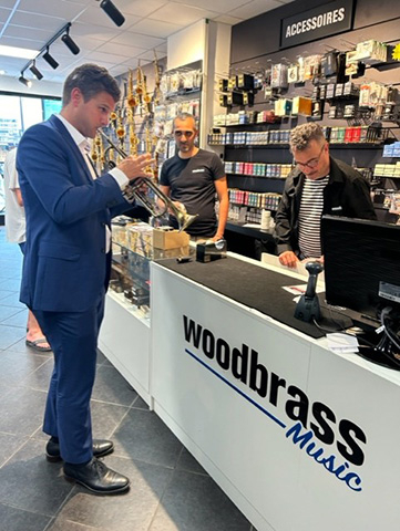 NAMM CEO plays woodbrass music trumpet