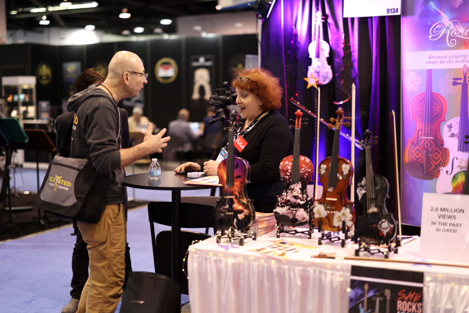 namm show exhibitor talks with attendee