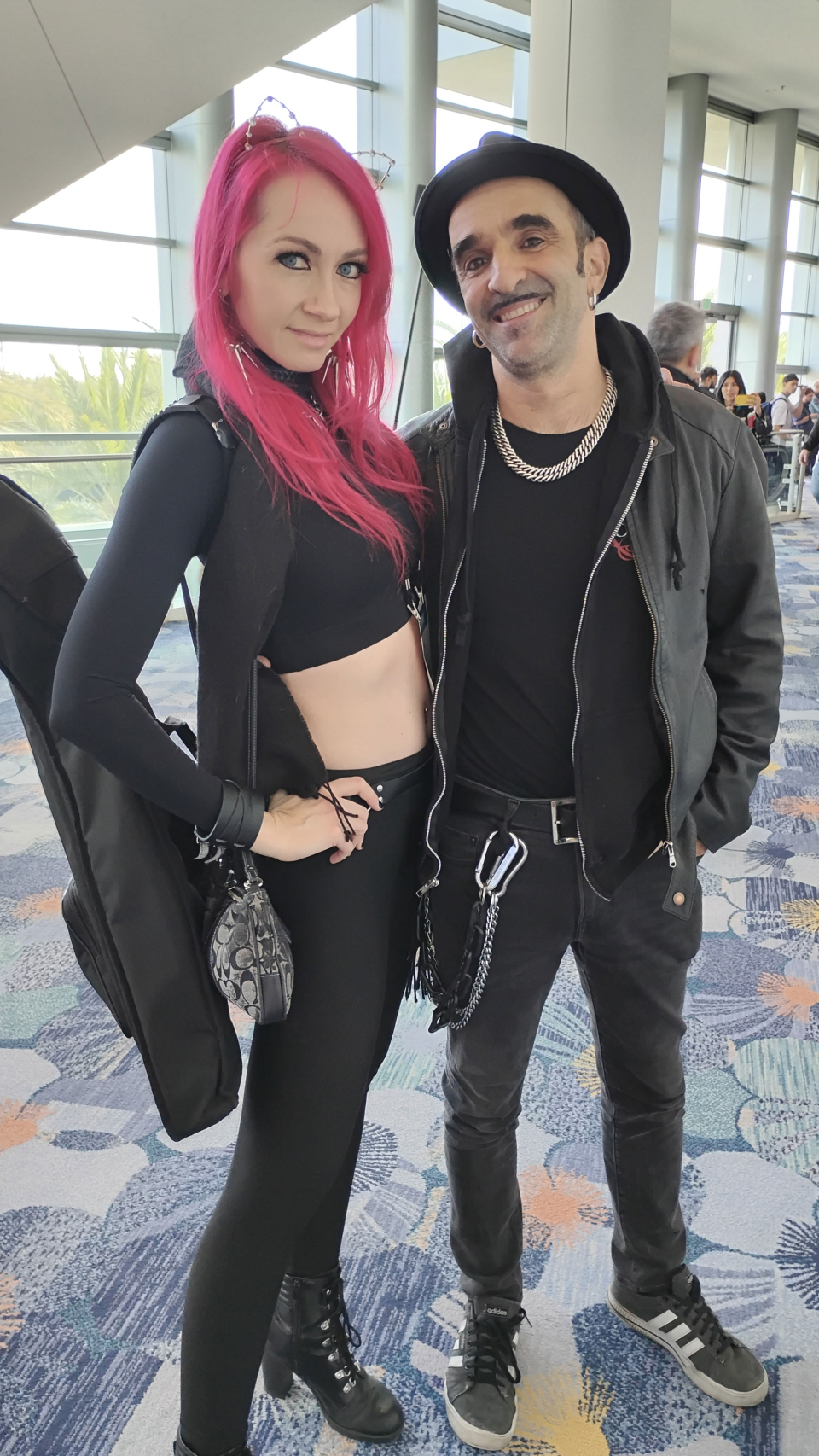 couple dressed in black at the namm show