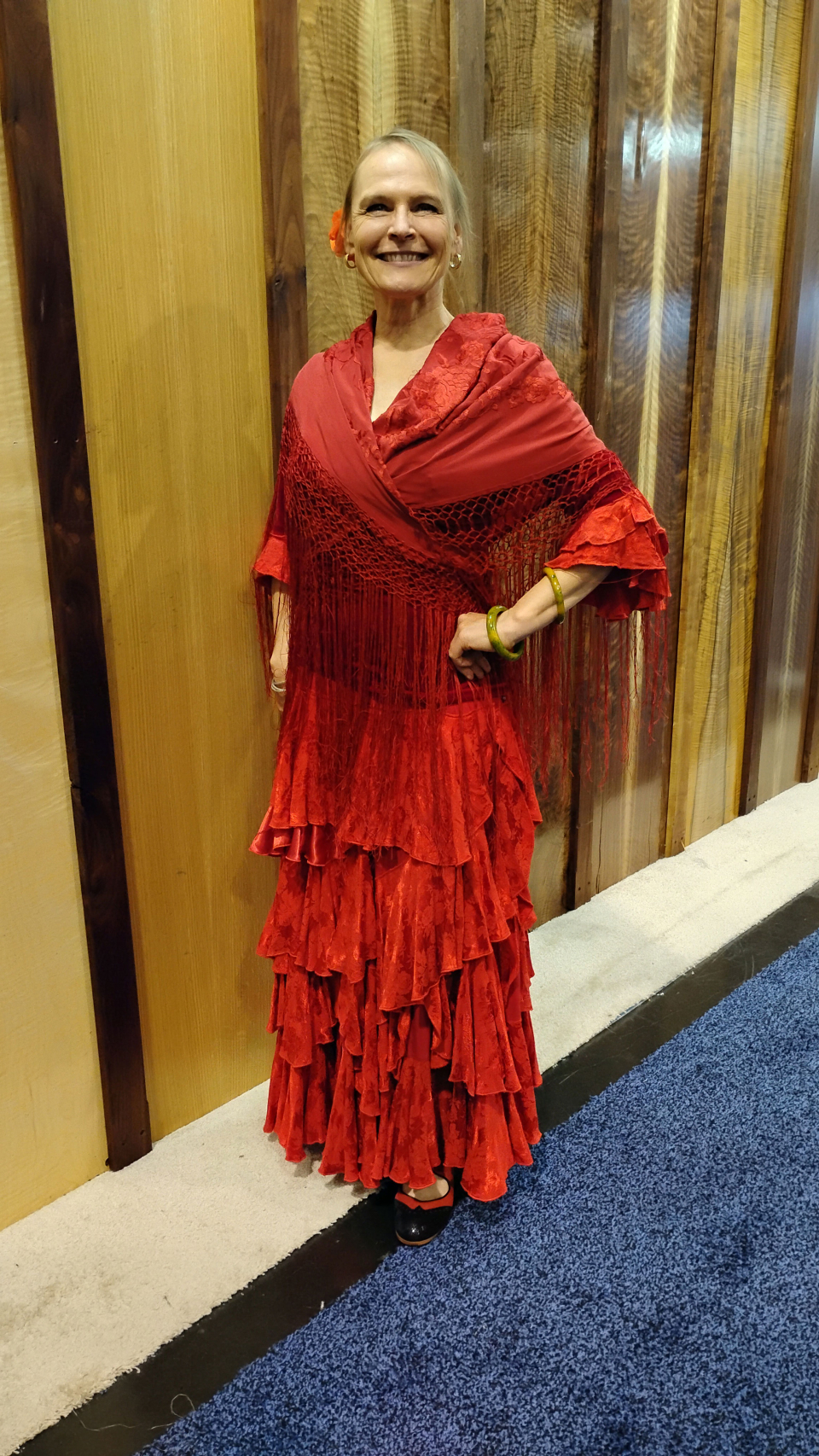 a flamenco dancer in red shawl and skirt at the namm show