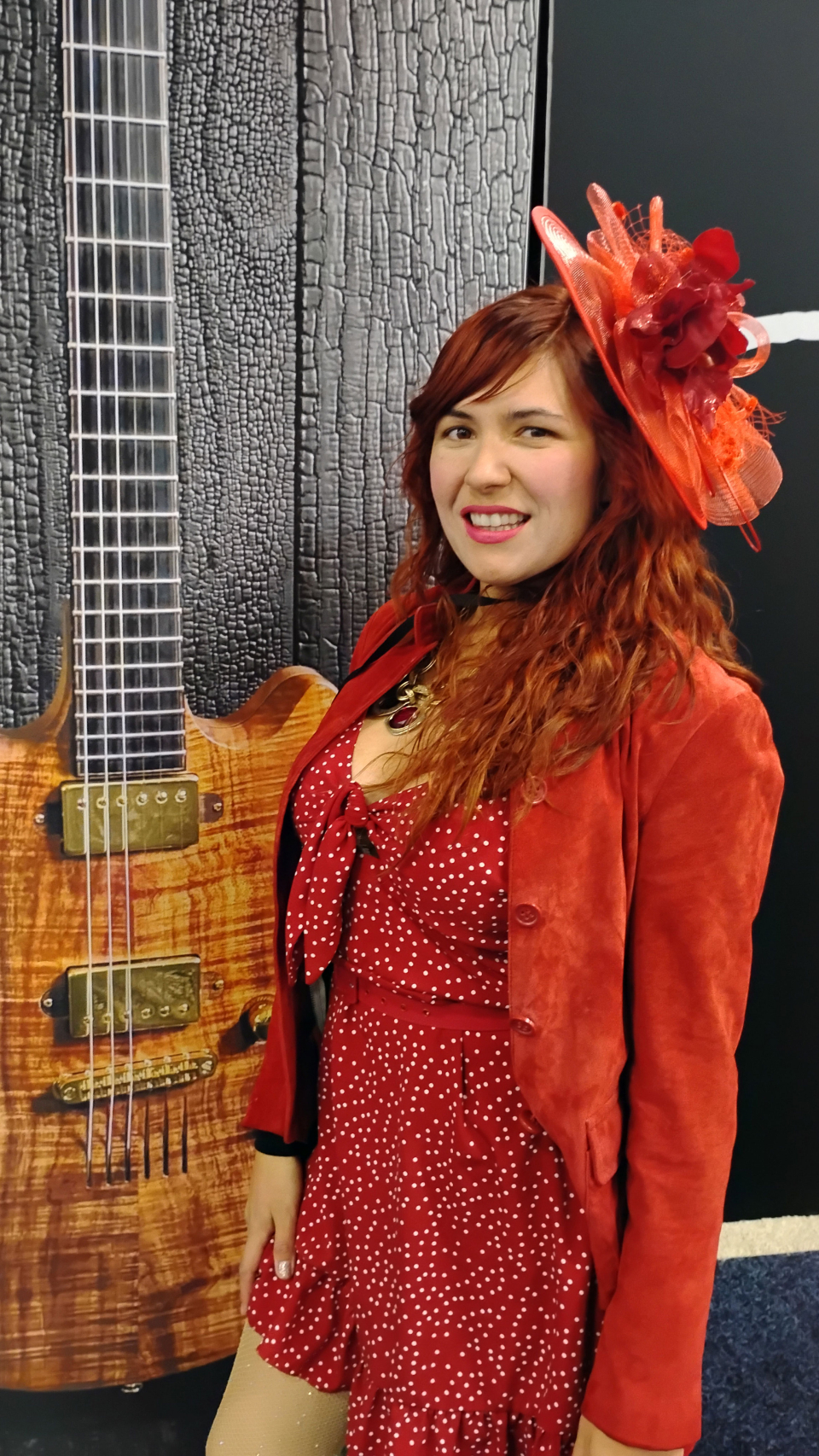 lady with red fastener hat at the namm show