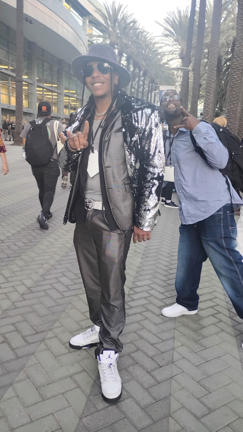 man in a sliver sequin jacket at the namm show