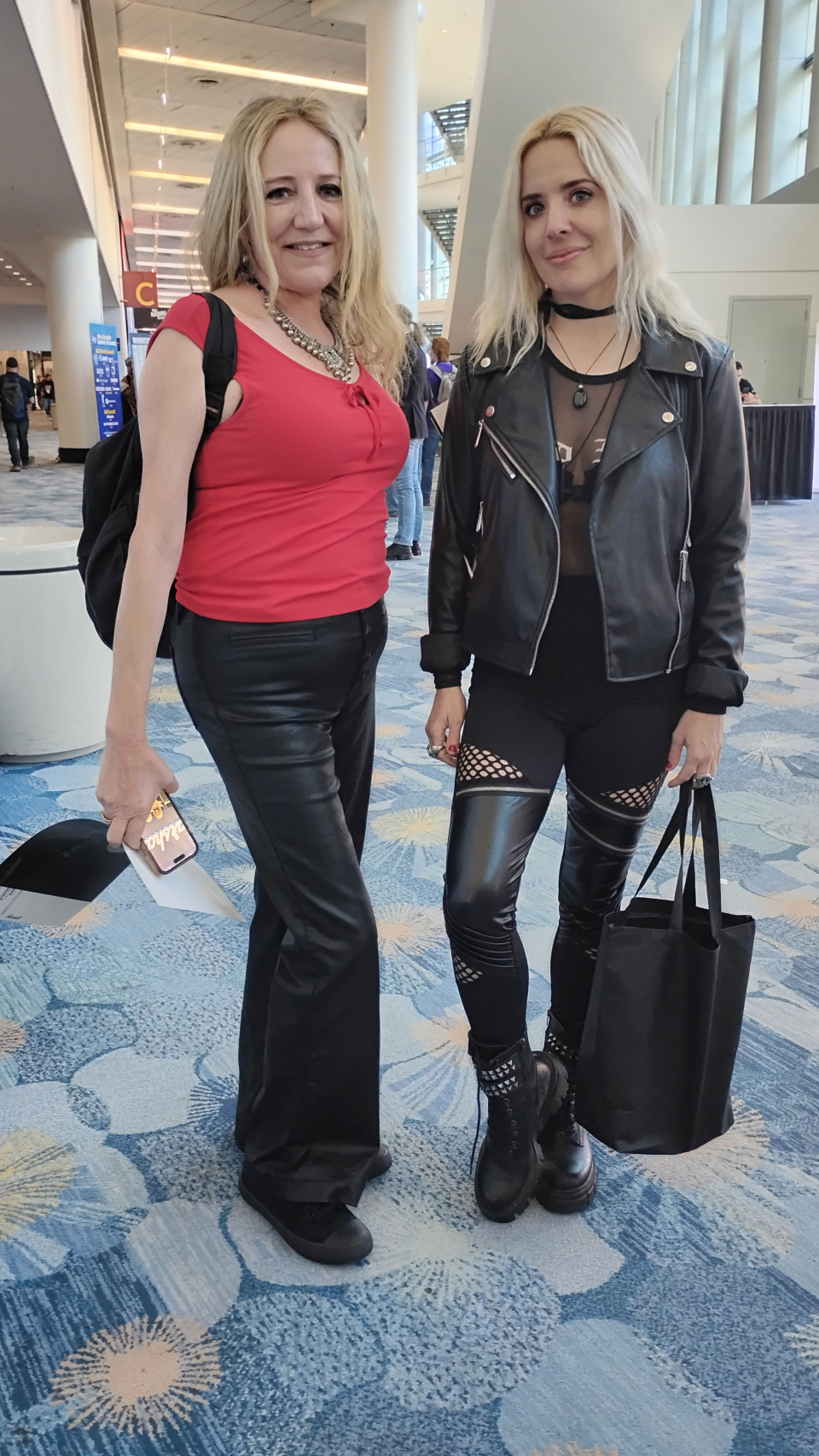 two ladies show off their fashion at the namm show