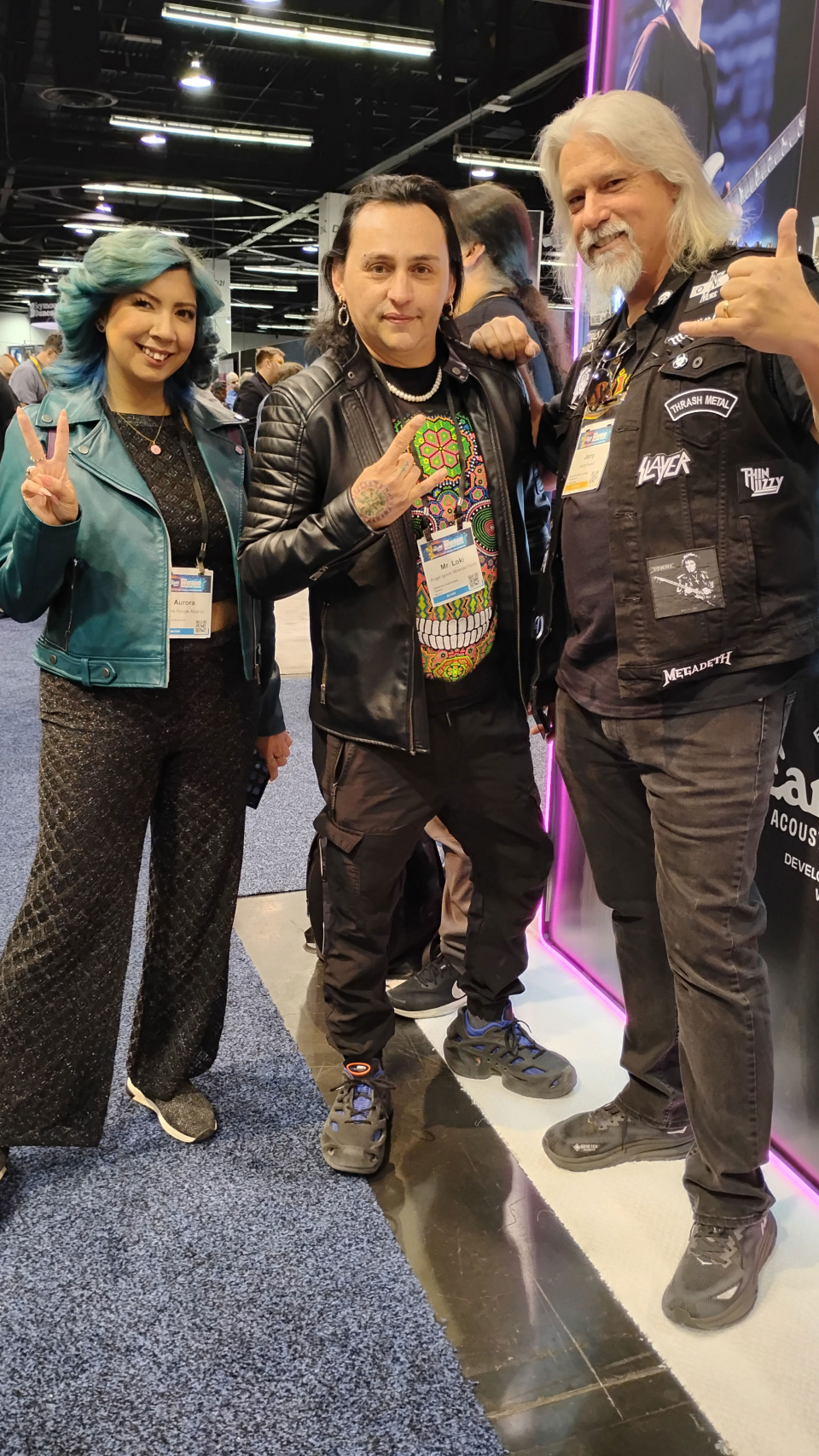 three attendees in their rock outfits