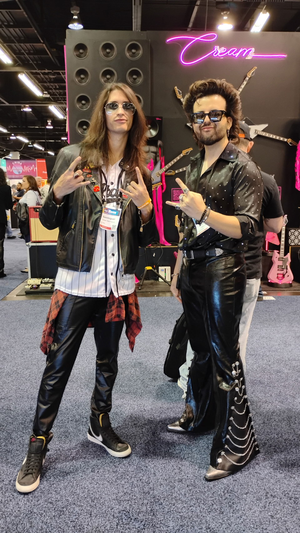 two men in rocker outfits at the namm show