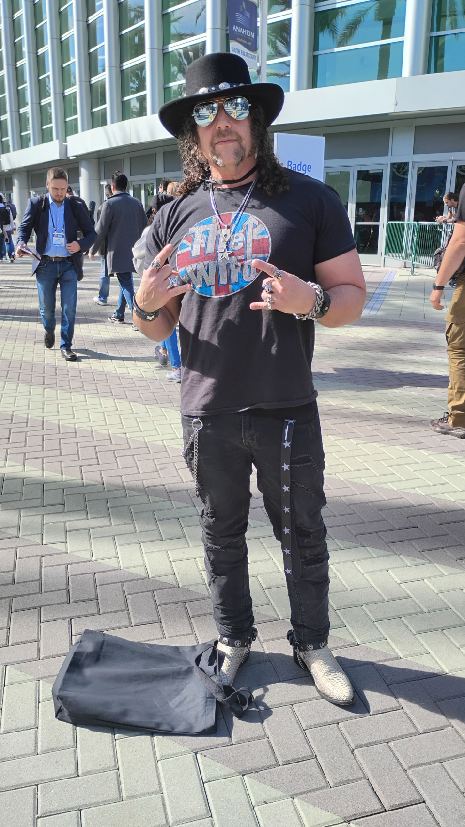 man with cowboy hat outside anaheim convention center for the namm show