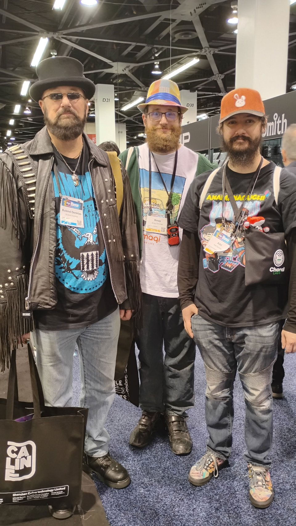 three men with fun hats at the namm show